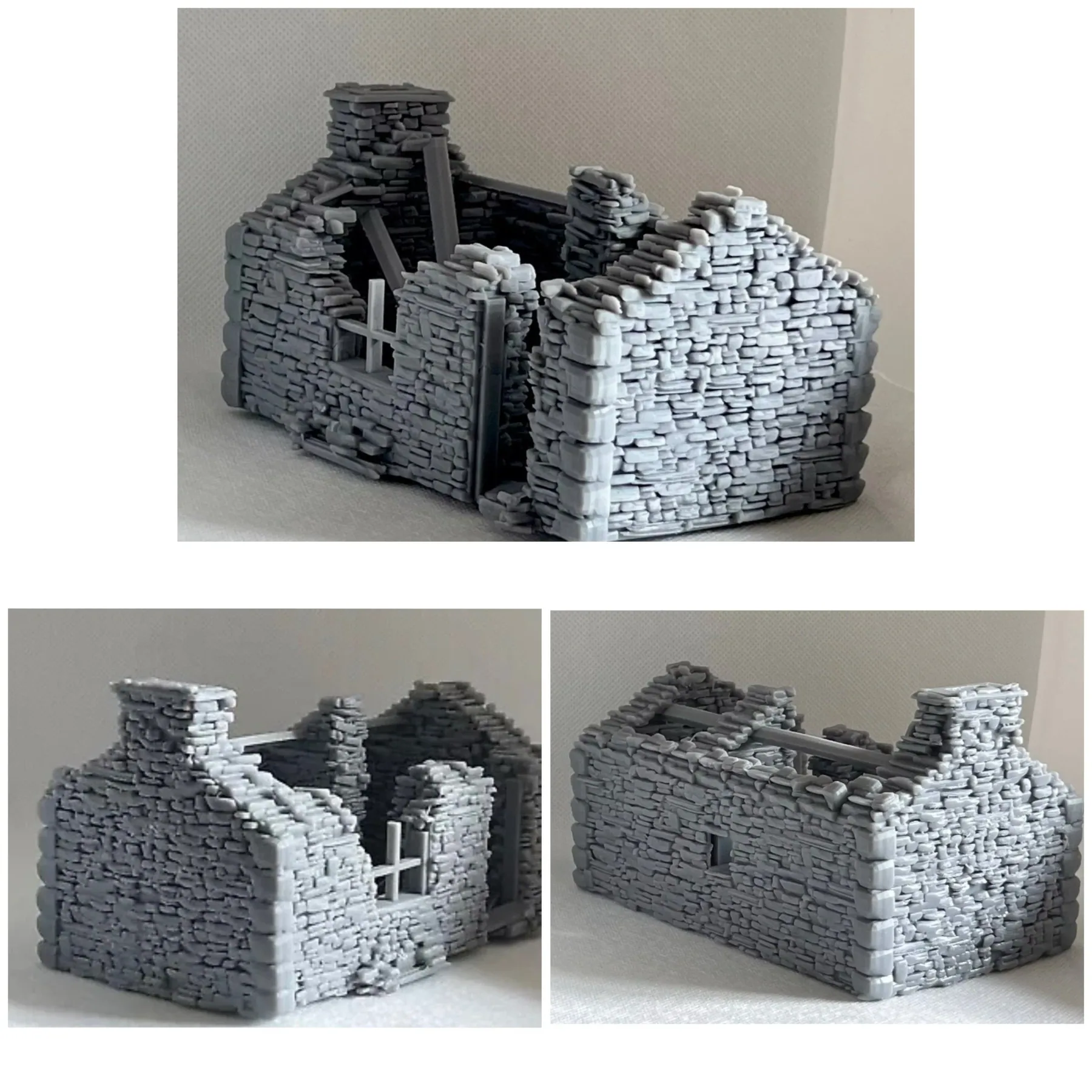 Three views of a small model stone ruin with broken gable walls